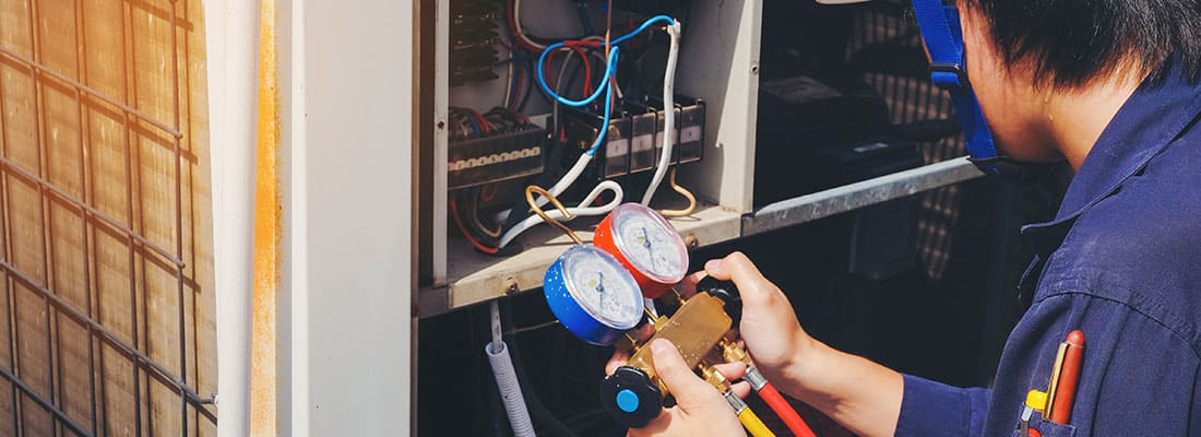 Technician is checking air conditioner