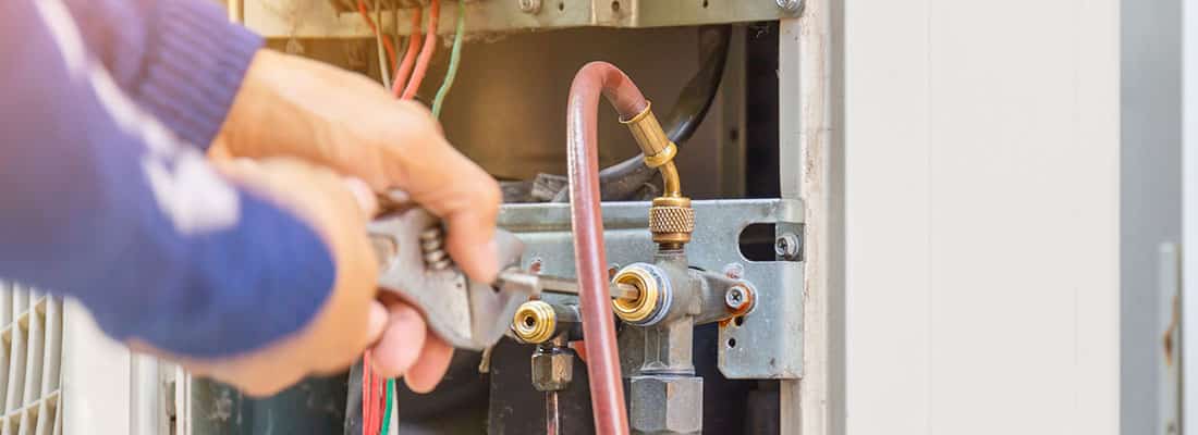 Selective focus of Air Conditioning Repair, repairman on the flo